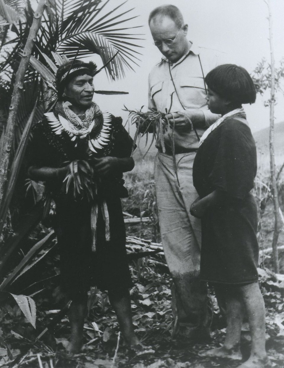 Historical photograph of Richard Evans Schultes with two Indigenous people in the Amazon, circa the 1940s